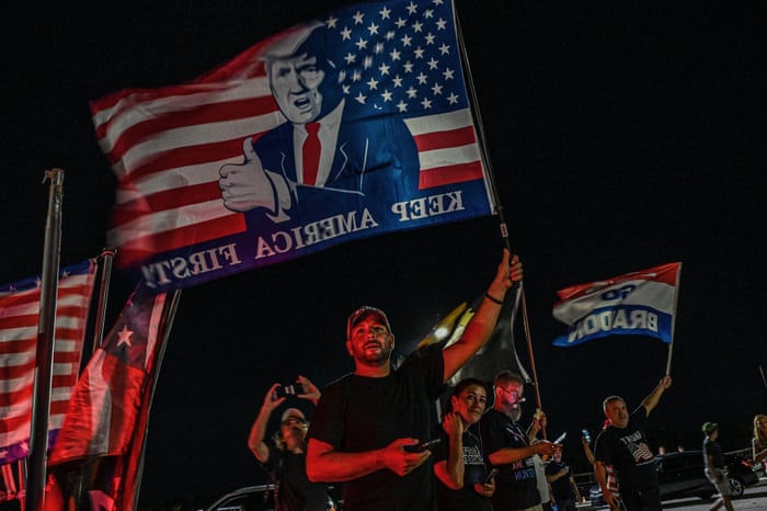 Supporters of former US President Donald Trump stand outside his residence residence in Mar-A-Lago, Florida.