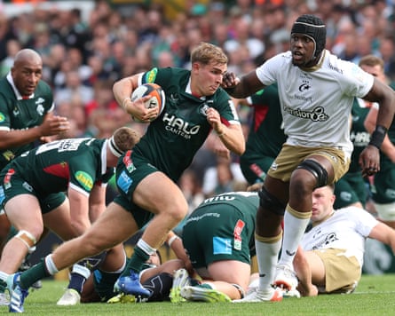 Leicester’s Jack van Poortvliet charges past Maro Itoje