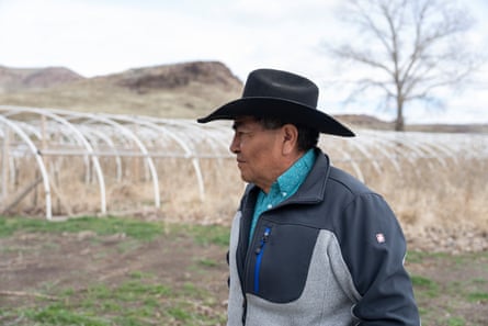 a man in a hat on a farm