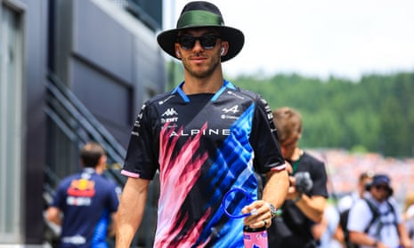Pierre Gasly of France walks through the paddock.