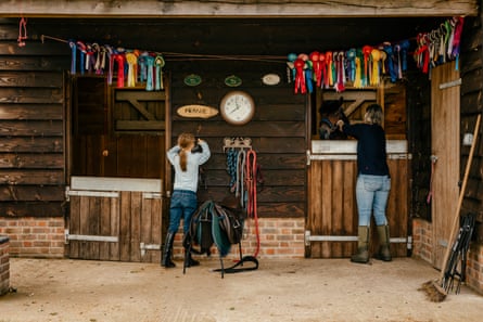 Lyndsey Stride and her daughter Milly tend to one of the ponies at their home.