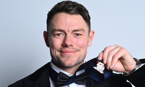 Lachie Neale of the Lions poses for portraits with the Brownlow Medal.