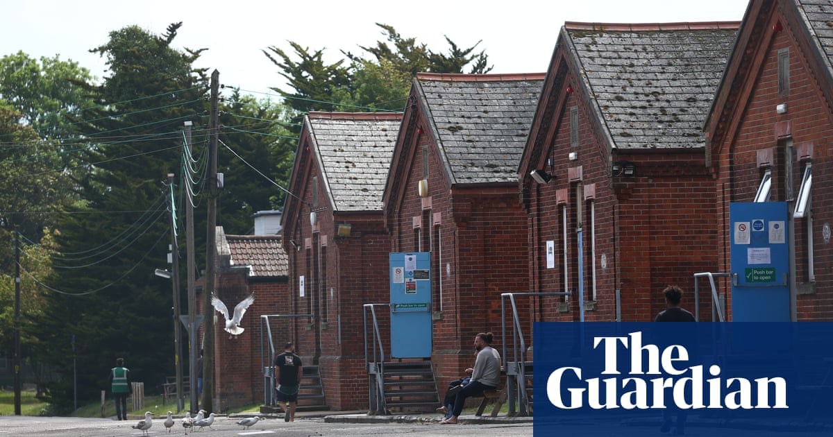 Asylum seekers in UK housed in converted hostel with prison cells
