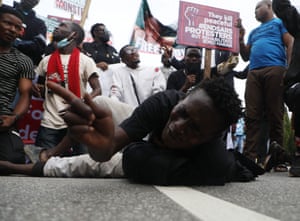 Abuja, Nigeria: demonstrators carry placards on a protest to mark the first anniversary of #EndSars, a protest movement against police brutality