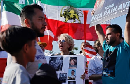 Protesters demonstrate against the Islamic Republic of Iran as soccer fans enter Los Angeles Stadium