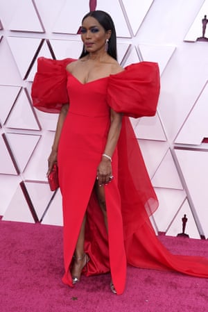 Quality Street couture from Angela Bassett. Super-sized sleeves and a tulle cape, with a huge bow on the back, make it extra delicious.