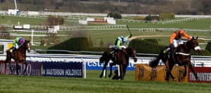 Long Run edges past Denman and Kauto Star (left) in the final stages to take the Gold Cup.