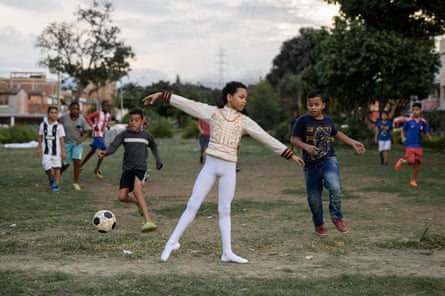 Santiago Fernandez at age 11 practising ballet while other children play football