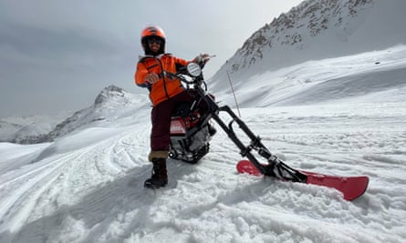 man with moonbike on snow