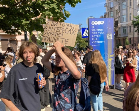 A group of young people taking part in a protest against Volodymyr Zelenskyy's decision to fire defence minister Mykhailo Fedorov in Kyiv, Ukraine