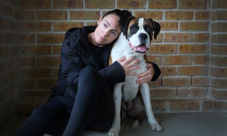 Sarah Coyte sits with her dog, Bonnie, at home in Sydney, Australia.