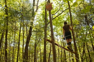 From a constructed lookout in the support camp, Erin Mckelvy watches the police and pipeline workers to ensure nothing is done to endanger the safety of “Nutty”.