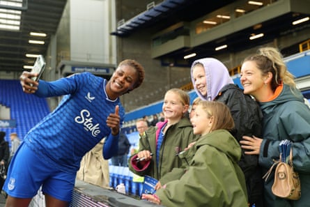 Kelly Gago of Everton takes a selfie with fans at Goodison Park.