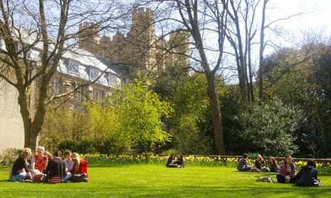 Students on grass next to the HH Wills physics building at Bristol University.