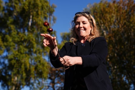 Penny Mordaunt plays conkers in a park