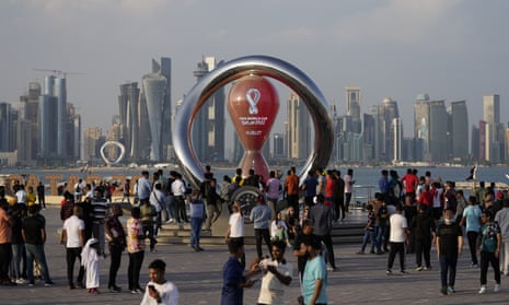 People gather around the official countdown clock in Doha as the World Cup edges ever closer.