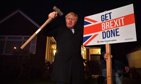 Boris Johnson poses after hammering a “Get Brexit Done” sign into the garden of a supporter in Benfleet, Essex, December 2019