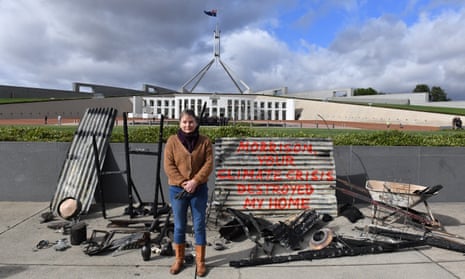 Melinda Plesman with the remains of her burnt-out house, outside Parliament House in Canberra