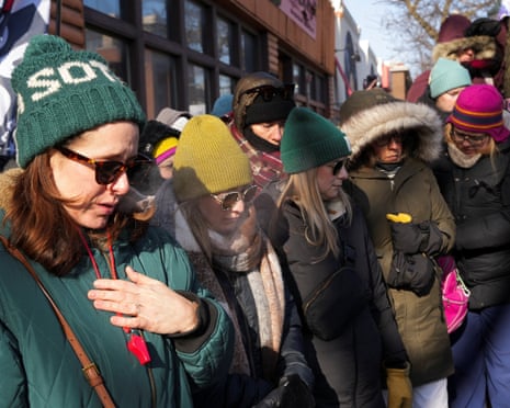 People gathered at a makeshift memorial at the site where Alex Pretti was fatally shot