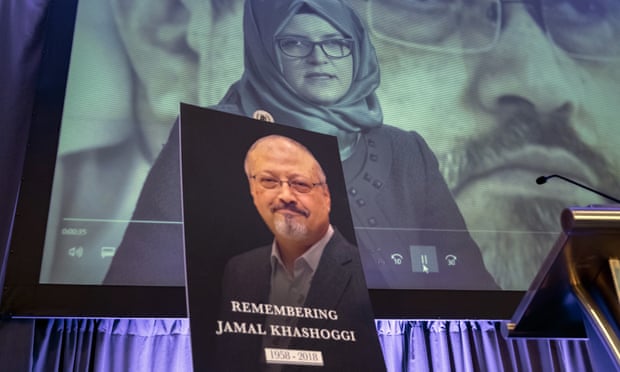 Video footage of Hatice Cengiz appears on screen during a memorial event for her fiancee Jamal Khashoggi in Washington in November.