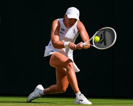 Iga Swiatek crunches a backhand against Amanda Anisimova in her 6-0, 6-0 win in the Wimbledon final.