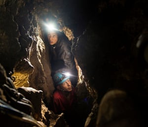Lee Bergen’s daughter Megan and underground exploration team member Rick Hunter navigate the narrow chutes leading to the Dinaledi chamber.