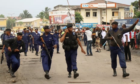 Riot police disperse crowds in Kinshasa, the Democratic Republic of the Congo