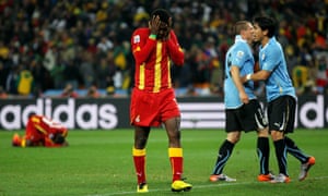 Asamoah Gyan reacts after missing his last-gasp penalty kick.