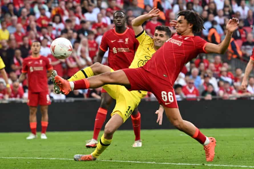 Liverpool's Alexander-Arnold beats Chelsea's Christian Pulisic to the ball and clears the danger.