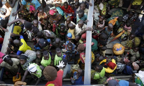 Refugees who fled Burundi wait at Kagunga on Lake Tanganyika, Tanzania, in May 2015.