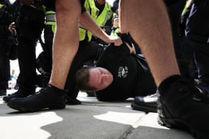 Police arrest a demonstrator at Vienna/Fairfax station outside Washington DC