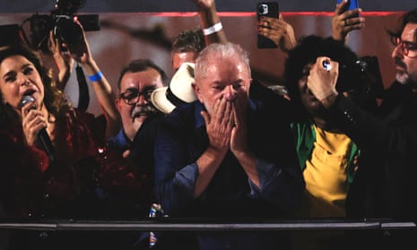 Brazilian President-elect Luiz Inacio Lula da Silva blows a kiss to his supporters during victory celebrations.