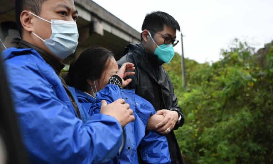 Grieving relatives arrive at the site.