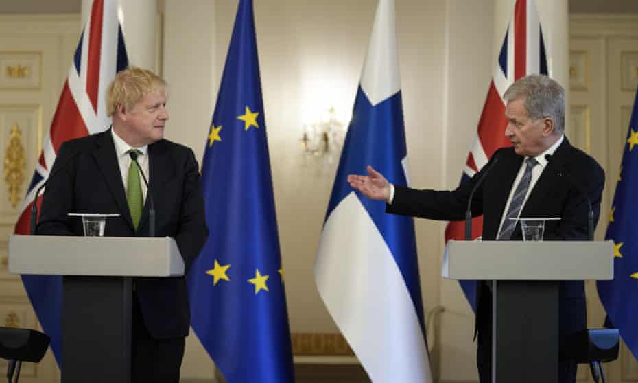 Boris Johnson and Finland's President Sauli Niinisto speak to the media at the presidential palace in Helsinki