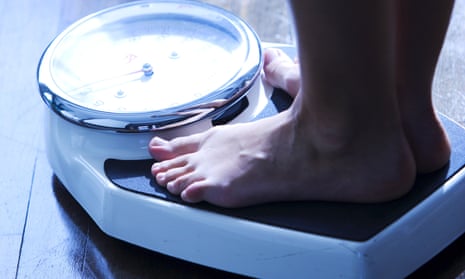 A person standing on scales