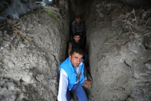 Terter, Azerbaijan
People take shelter in a dugout during the fighting over the breakaway region of Nagorno-Karabakh in the city of Terter