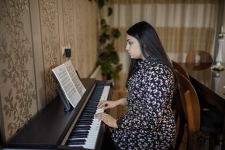 Masiha plays the piano