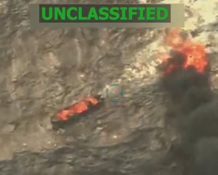 A still from a video shows a burning boat.
