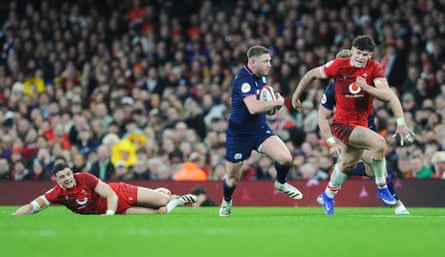 Finn Russell breaks through the Welsh defence in Cardiff
