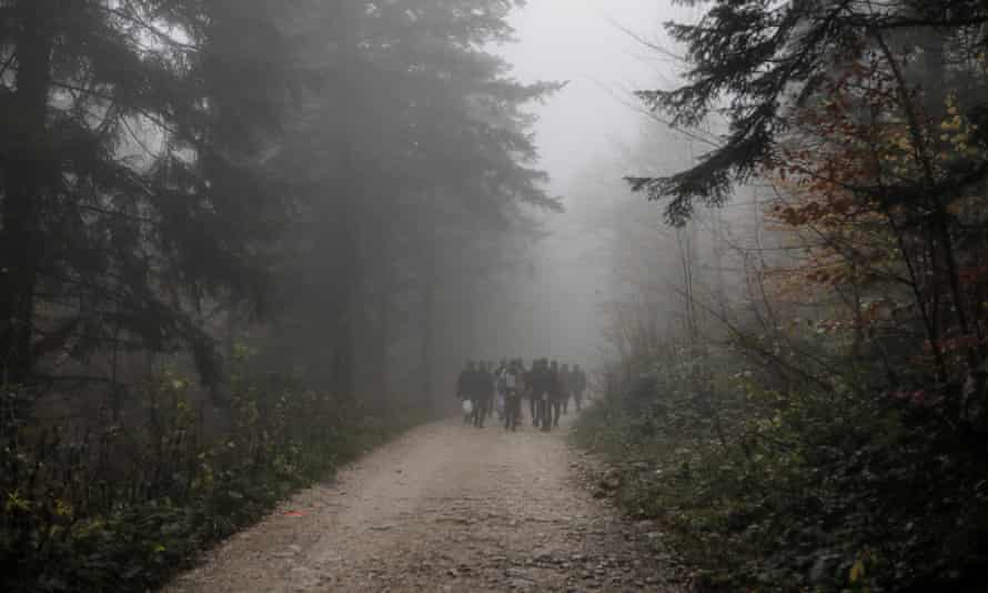 Migrants walk through the woods towards Vucjak camp near Bihac, Bosnia and Herzegovina, 14 November 2019.
