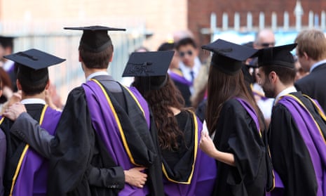 Students from the London School of Economics wear mortar boards and gowns during a ceremony for university graduates in London,