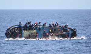 An overcrowded boat about to capsize in the Mediterranean