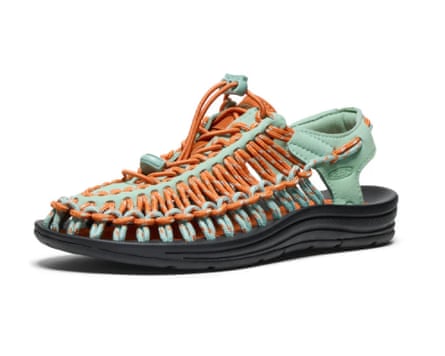 A Keen Women’s UNEEK Sneaker in orange and mint green.