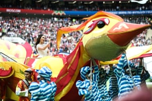 Russian soprano Aida Garifullina enters the field on a giant bird and joins in with Robbie for a medley of some of his hits