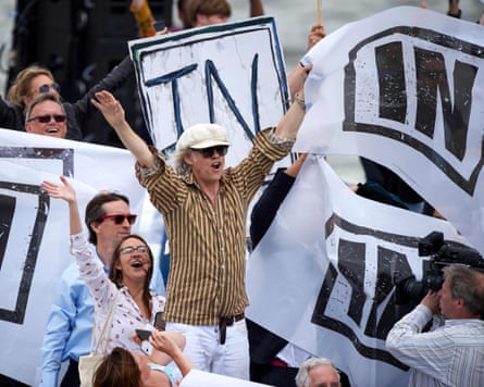 Bob Geldof and supporters with ‘In’ flags on a boat.