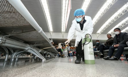 A worker disinfects a railway station in Nanchang City, Jiangxi province, China.