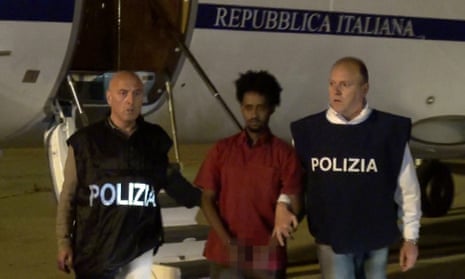Italian police with the arrested man in 2016. Prosecutors say he is the alleged trafficker Medhanie Yehdego Mered, but he is apparently refugee Medhanie Tesfamariam Berhe.