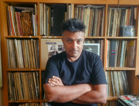 Ash in front of some of his vast music collection.