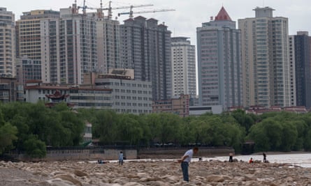 Skyscrapers under construction along the shore of the Yellow river in Lanzhou, China