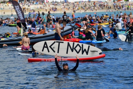 Protesters take part in a paddle out, organised by Surfers Against Sewage, on Gyllyngvase Beach near Falmouth, during the G7 summit in Cornwall in June.